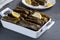 Yaprak sarmasi is a traditional Turkish dish made by wrapping rice stuffing with grape leaves