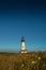 Yaquina Head Lighthouse Sits Below Deep Blue Sky