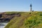 Yaquina Lighthouse surrounded by wildflowers on the Oregon Coast