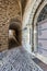 The yard of Hotel Dieu in Le Puy Cathedral with the walk pass to the Cloister. Le Puy-en-Velay town in Haute-Loir department,