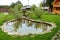 Yard lawn green grass and ornamental pool