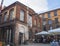 Yard in Lodz city center with restaurants and old red brick fact