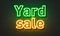 Yard sale neon sign on brick wall background.