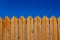 Yard wooden fence palisade garden object vivid blue sky background and empty copy space for your text