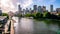 Yarra river view in central Melbourne with riverbank promenade and Melbourne CBD skyline in Victoria Australia