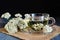 Yarrow medicinal tea in glass cup on dark