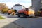 Yaslo, Poland - 9 9 2018: Sewage clearing by special technical means on the streets of a small European town. Orange cars and muni