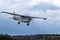 Yaslo, Poland - july 1 2018: A light sport turboprop aircraft flies across the sky among the rainy clouds. Landing in difficult we