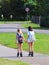 Yaslo, Poland - july 10 2018: Two girls rollerblading holding hands. Active lifestyle. Children on summer vacation. Fashionable ch