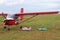 Yaslo, Poland - july 3 2018: Models of airplanes on the airfield stand near the light two-seater turboprop aircraft of red color.