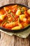 Yataklete Kilkil Wonderful Spicy Ethiopian Vegtable Stew closeup on a plate. Vertical