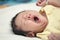 Yawning newborn baby boy asleep on his bed