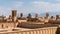 Yazd cityscape with old brick buildings and badgirs wind catching towers in Yazd, Iran