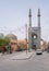 Yazd, Iran - 13.04.2019: Jameh Mosque of Yazd with its tall minarets and turquoise tiles. People walking in the street