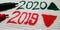 Year 2020 2019 displayed with green and red arrow on white background