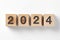 The year 2024 text on wooden cube. A new era of creative inspiration and concept background. Make a fresh start in your planning