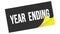 YEAR  ENDING text on black yellow sticker stamp