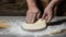 Yeast dough for bread or pizza on a floured surface, with flour splash. Cooking bread. Kneading the Dough