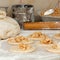 Yeast dough with flour. Making apple pies.