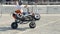 Yekaterinburg, Russia-August, 2019: Man on Quad bike stunts at festival. Action. Quad rider rides around square and