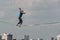 Yekaterinburg, Sverdlovsk Russia - 17 08 2019: A man tightrope walker athlete extreme in blue pants and blue t-shirt walks over