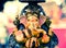 Yello Ganesh Elephant God in Hindusim mythology in rich king pos