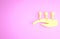 Yellow Acupuncture therapy on the hand icon isolated on pink background. Chinese medicine. Holistic pain management