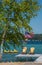 Yellow adirondack chairs on a boat dock