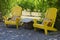 Yellow Adirondack Chairs on a Patio