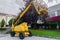 Yellow aerial platform on the street