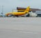 Yellow Airbus A300-600 DHL parcel delivery plane in Airport