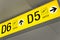 Yellow airport direction departure sign