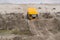 Yellow all-terrain vehicle touring through sandy hills