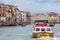 Yellow ambulance boat in use on the Canal Grande in Venice. Emergency medical service in Venice`s canals and waterways.