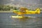 Yellow amphibious seaplane taking off from Lake Casitas, Ojai, California