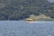 Yellow amphibious seaplane taking off from Lake Casitas, Ojai, California