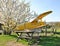 Yellow Antonov behind small fence