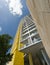 Yellow apartment block cloud perspective