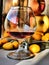 Yellow apples and kumquat with a glass of wine fruits