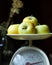 Yellow apples on old fashioned scales, closeup view