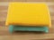 Yellow and aqua colored scrub pads