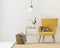 Yellow armchair against a white wall