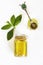 Yellow aromatic mint oil in glass jar and decorative spoon