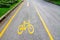 Yellow arrows and bicycle sign path