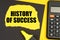 On a yellow background, a calculator, a black sheet, a marker and a yellow torn sheet with the inscription - History of success