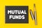 On a yellow background lies a pen and a black notebook with the inscription - Mutual Funds