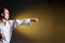 On a yellow background, a young athlete makes a punch arm