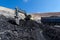 yellow backhoe work in coalmine