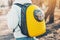 Yellow backpack with a transparent window porthole for walking and carrying cats. Concept of a hiking with pet in park or