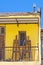 Yellow balcony with easels